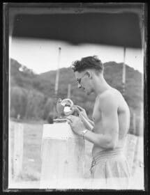 2013.70.9005 Sailor inspecting a sunshine recorder