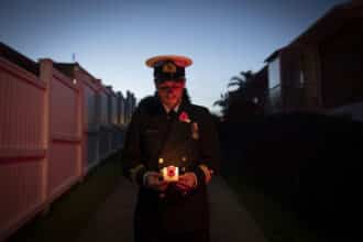 - LT Samuel Fox stands in his driveway for Stand at Dawn ceremony, Anzac Day 2020, Standing Apart, Together As One.