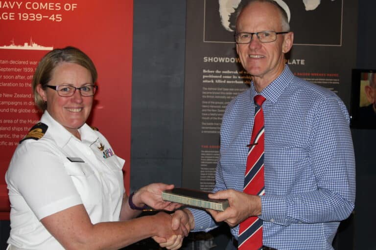 IMG_3661 David Wright - Navy Museum Director accepting a donation from Commander (now Captain) Lisa Hunn