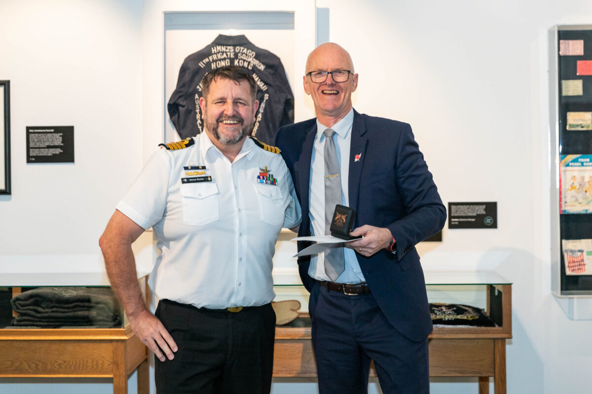 David receiving his Civilian Service Recognition Badge from Commodore Simon Rooke, 2024.