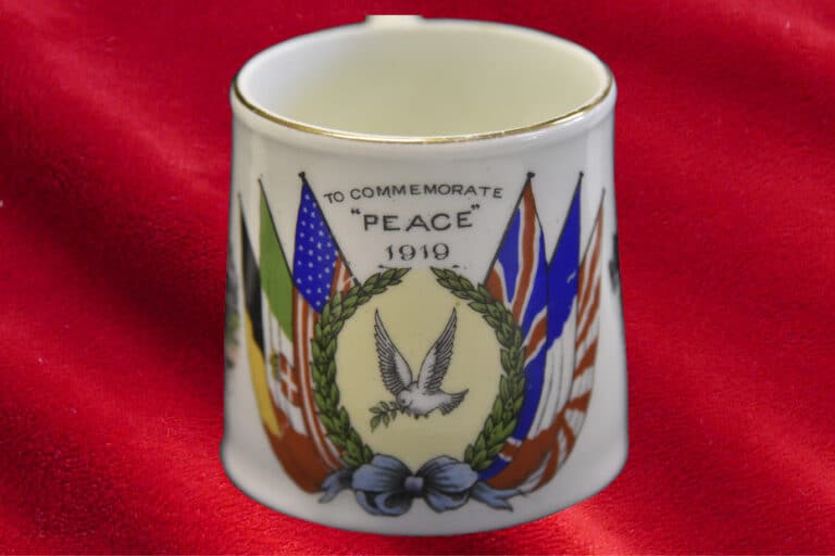 Small china cup commemorating declaration of Peace on 28 June 1919 when the Treaty of Versailles was signed, setting the peace terms for the defeated Central Powers: Germany, Austria-Hungary, the Ottoman Empire and Bulgaria. The Armistice signed the previous year on 11 November 1918, did not mark the official end of the war; as the terms of peace had not yet been signed. The cup is part of the Museum’s Education handling collection. Small china cup commemorating declaration of Peace on 28 June 1919 when the Treaty of Versailles was signed, setting the peace terms for the defeated Central Powers: Germany, Austria-Hungary, the Ottoman Empire and Bulgaria. The Armistice signed the previous year on 11 November 1918, did not mark the official end of the war; as the terms of peace had not yet been signed. The cup is part of the Museum's Education handling collection.