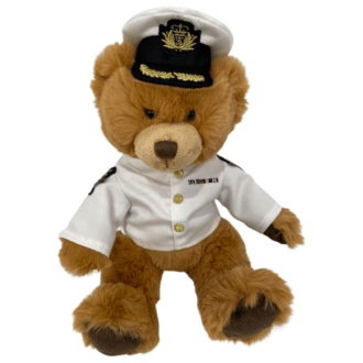 Teddy bear in white officer navy uniform